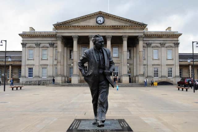 A statue of Harold Wilson greets visitors to Huddersfield railway station.
