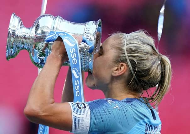 The prize: Manchester City Women's Steph Houghton celebrates with the trophy after the Women's FA Cup Final at Wembley Stadium, where they defeated West Ham.