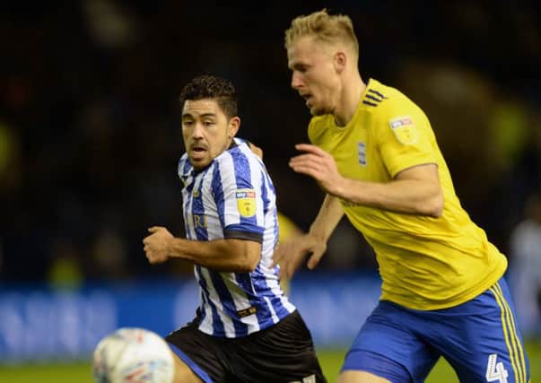 In a chase: Owls' Massimo Luongo with Birmingham's Marc Roberts. Picture: Steve Ellis