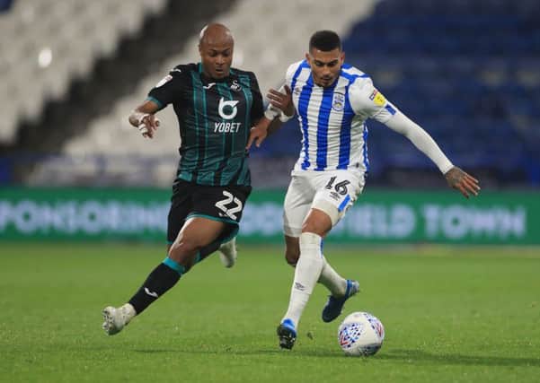 Top scorer: Huddersfield Town's Karlan Grant, right, and Swansea City's Andre Ayew.
