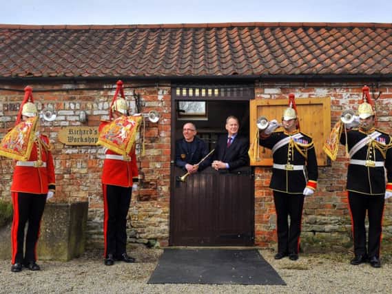 Trumpeters from the Household Cavalry paid a visit to Smith- Watkins trumpet maker from near Sheriff Hutton to play some of their instruments and played their instruments outside the workshop watched by trumpet maker Richard Wright (centre left) and Richard Smith designer and owner of the company. Picture: Gary Longbottom.