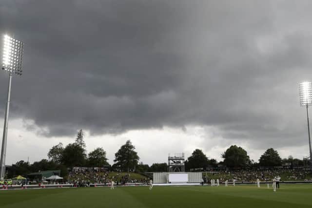 Lights illuminate the field at the start of the last session of play on day one of the second cricket test between England and New Zealand at Seddon Park in Hamilton. (AP Photo/Mark Baker)