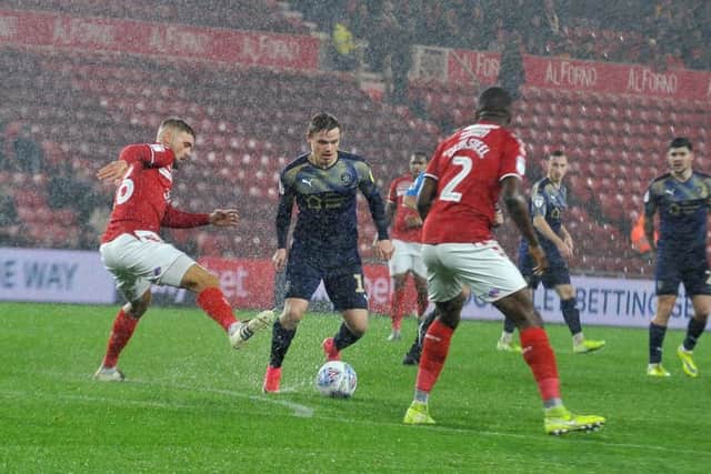 Barnsley
's Luke Thomas isclosed down by Boro's Lewis Wing on Wednesday night. (Picture: Tony Johnson)