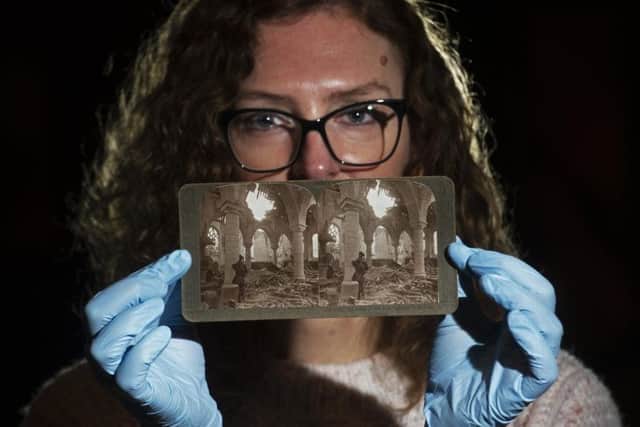 Leeds artist Helen Dryden with original First World War stereogram photographs from the Leeds City Museum collection. 
Helen has worked with a small group of volunteers and has used the historic photos taken on the front lines To create moving 3D images. 
Picture: Tony Johnson
