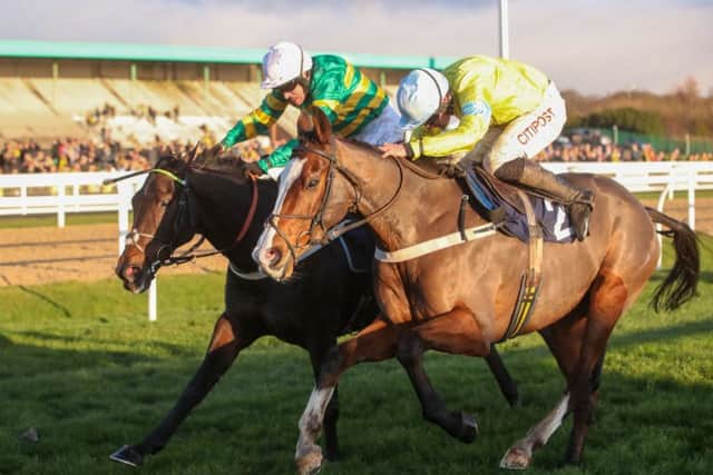 Cornerstone Lad and Henry Brooke, right, hold off Buveau D'Air and Barry Geraghty to win the Fighting Fifth at Newcastle on Saturday. Picture supplied by Grossick Racing