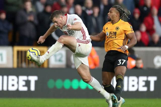 Sheffield United's Jack O'Connell (left) and Wolverhampton Wanderers's Adama Traore challenge for the ball. (Picture: PA)