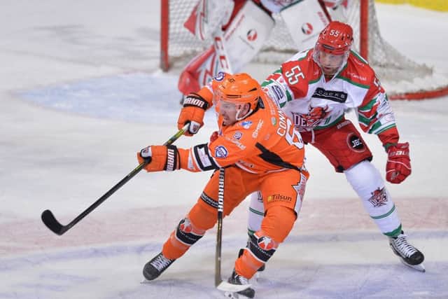 Sheffield Steelers' Brendan Connolly battles with Cardiff Devils' Shaone Morrison during Saturday night's 7-3 loss at the Sheffield Arena. (Picture: Dean Woolley)
