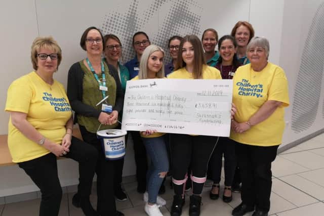 The Geddes Family present their fundraising to the staff at Sheffield Children's