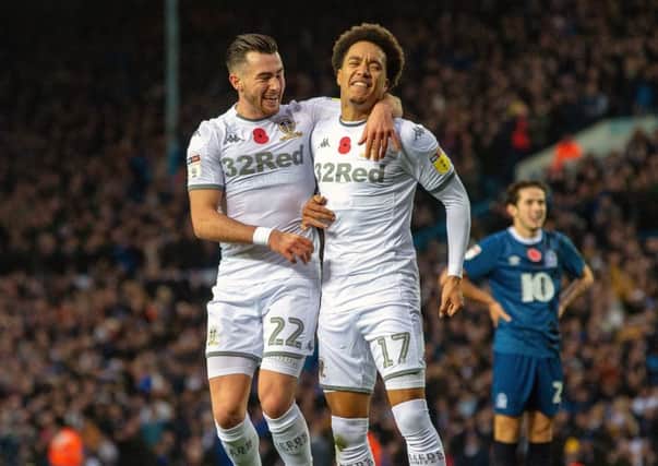 Patience reqarded: Jack Harrison celebrates scoring for Leeds with Helder Costa (Picture: Bruce Rollinson)