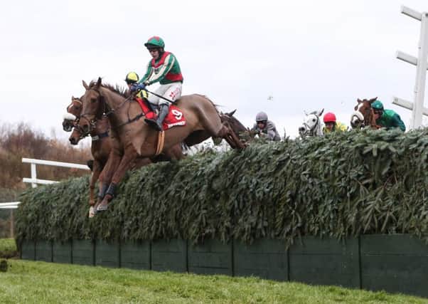 Vieux Lion Rouge and Tom Scudamore clear Becher's Brook in the 2016 Becher Chase. Photo courtesy of Aintree Racecourse and Grossick Racing Company.