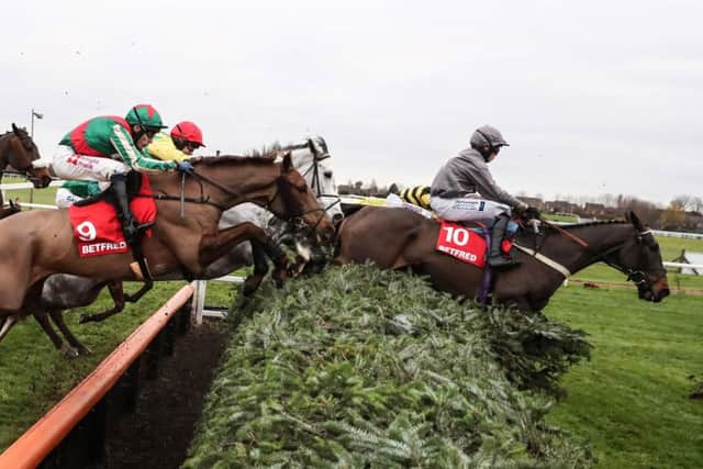 Vieux Lion Rouge - number 9 - clear a daunting ditch in the 2016 Becher Chase. Photo courtesty of Aintree Racecourse and Grossick Racing Photography.