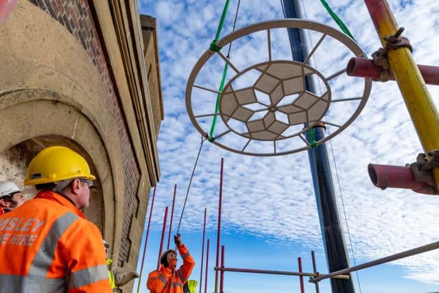 Crane Hire operator Emsley were lifting four restored dials back into the Terry's of York Clock Tower. Picture: James Hardisty