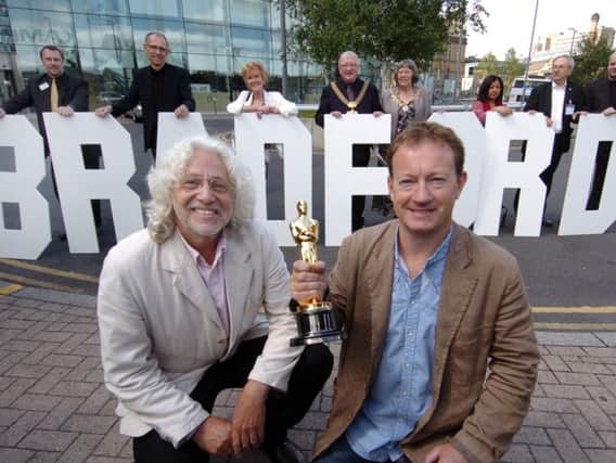 Library image of film producer Steve Abbott and Oscar winning Slumdog Millionaire screenwriter, Simon Beaufoy at the National Media Museum in Bradford.