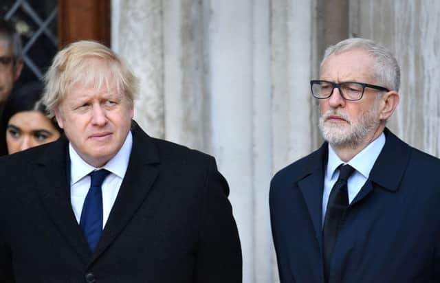 Prime Minister Boris Johnson (left) and Labour leader Jeremy Corbyn take part in a vigil in Guildhall Yard, London, to honour the victims off the London Bridge terror attack Photo: Dominic Lipinski/PA Wire