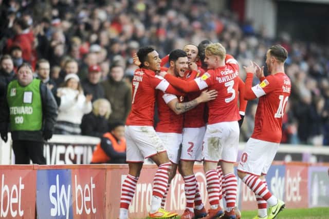 Barnsley's Alex Mowatt celebrates after he fires home the opening goal against Hull City.