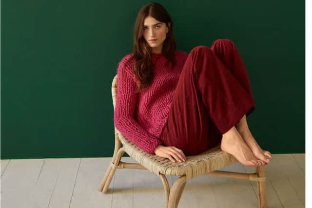 MATERIALLY MINDED: Model wears Jemima Corduroy Trousers in red, £89, and Lucia jumper, £145, both by People Tree. The hand knitted jumper is 100 per cent wool and PETA certified.