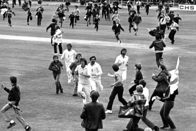 Bob Willis (centre) leading the side off after England's sensational victory over Australia in the Third Cornhill Test at Headingley in 1981 as the fans run on to celebrate.