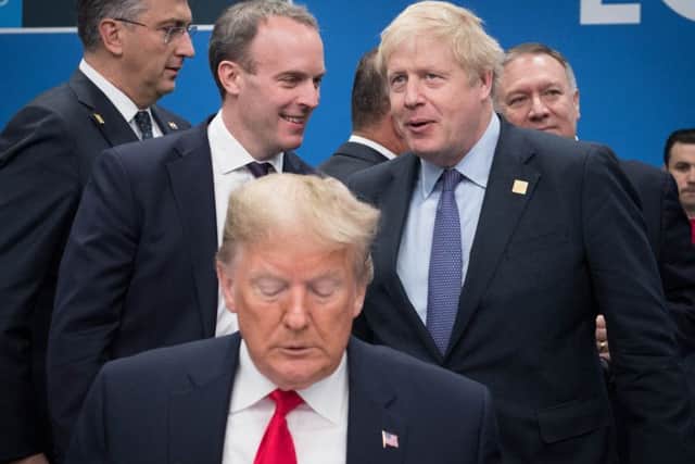 US President Donald Trump (front) with Foreign Secretary Dominic Raab (centre left) snd Prime Minister Boris Johnson(centre right) during the annual Nato heads of government summit.