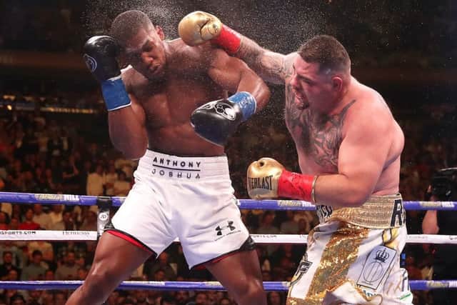Andy Ruiz Jr (right) lands a punch on Anthony Joshua in the WBA, IBF, WBO and IBO Heavyweight World Championships title fight at Madison Square Garden, New York. (Picture: Nick Potts/PA Wire)