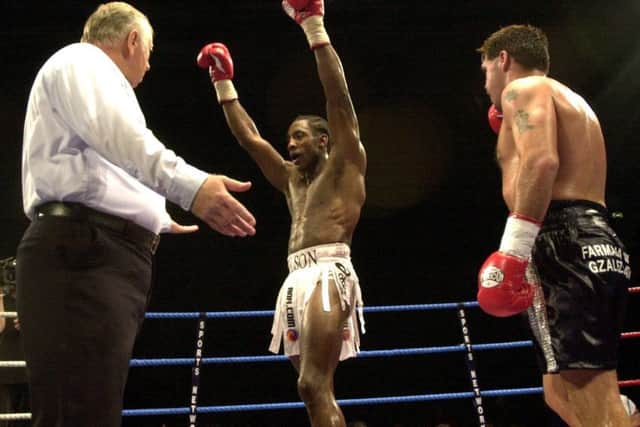 CHAMPION: Johnny Nelson celebrates beating Marcelo Dominguez from Argentina at Ponds Forge in 2002.