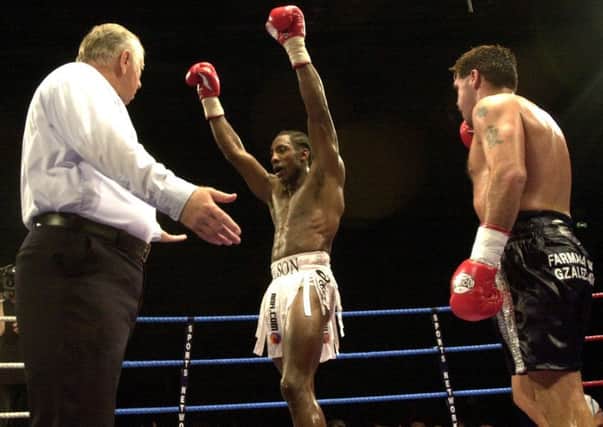 CHAMPION: Johnny Nelson celebrates beating Marcelo Dominguez from Argentina at Ponds Forge in 2002.