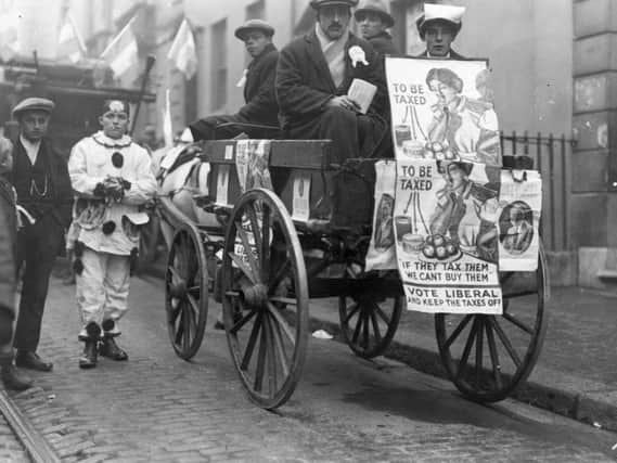 A wagonette decorated with Liberal Party posters during the general election campaign in 1923.