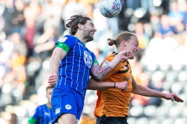 Charlie Mulgrew beats Tom Eaves to a high ball as 
Hull City met Wigan Athletic (
Picture: Bruce Rollinson)