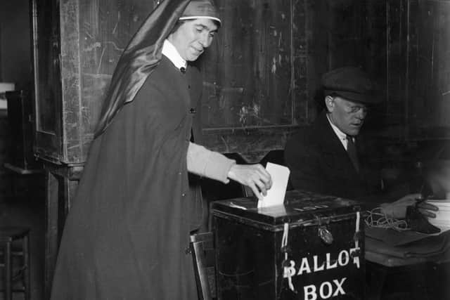 A nurse voting in the election.