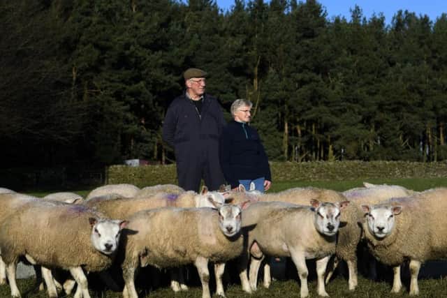 John and Christine Milner on their farm at Healey near Masham. Credit: Jonathan Gawthorpe