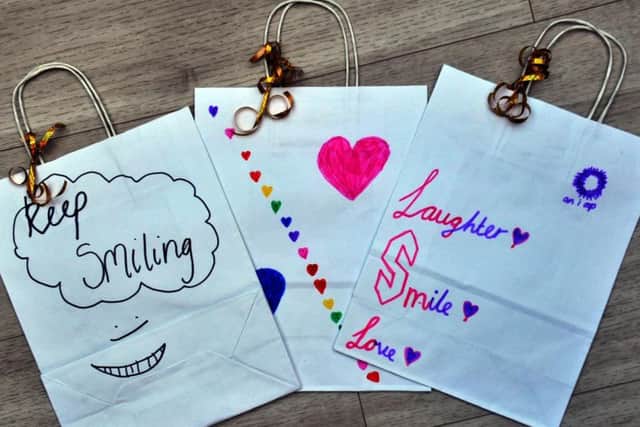 The giftbags, to be given to children in hospital in Leeds this Christmas-time, have been hand decorated by local Brownie, Guide and youth groups. Image: Gary Longbottom.