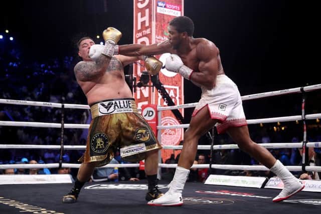 Anthony Joshua lands a right to the face of Andy Ruiz Jr as the Briton defeated the Mexican-American to reclaim the IBF, WBA, WBO and IBO World Heavyweight belts (Picture: Nick Potts/PA Wire ).