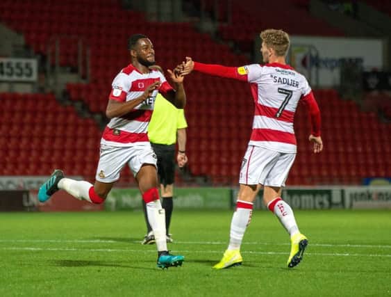 Cameron John, left, earned Doncaster Rovers a point from their home game with Milton Keynes Dons (Picture: Bruce Rollinson).