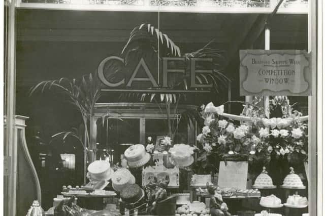 The cafes tradition of decorated festive windows goes back to the 1920s.