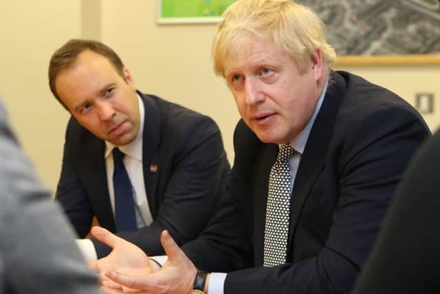 Boris Johnson during a visit to a hospital with Matt Hancock, the Health and Social Care Secretary.