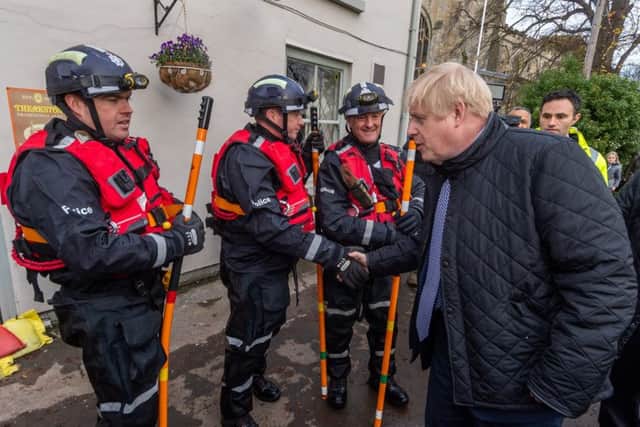 Boris Johnson during his belated visit to flood-hit South Yorkshire last month.