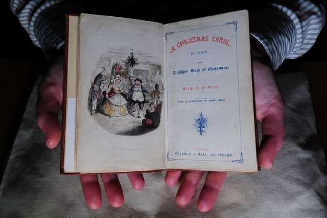 Richard High from the collections team at the Treasures of Brotherton Gallery  A Christmas Carol, by Charles Dickens dated 1843..10th December 2019.Picture by Simon Hulme