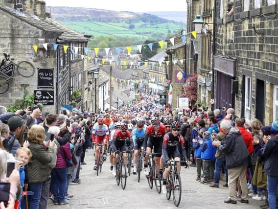 Team INEOS lead the peloton in Haworth, during stage four of the Tour de Yorkshire on Sunday May 5, 2019. Picture: Martin Rickett/PA Wire