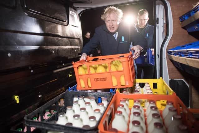 Boris Johnson began the final day of the election campaign on a milk round in Leeds - while dodging questions from reporters.