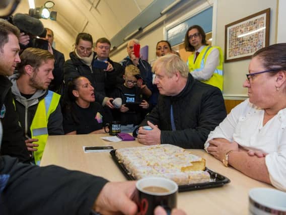 Boris Johnson meets locals in flood-hit South Yorkshire. Pic: James Hardisty