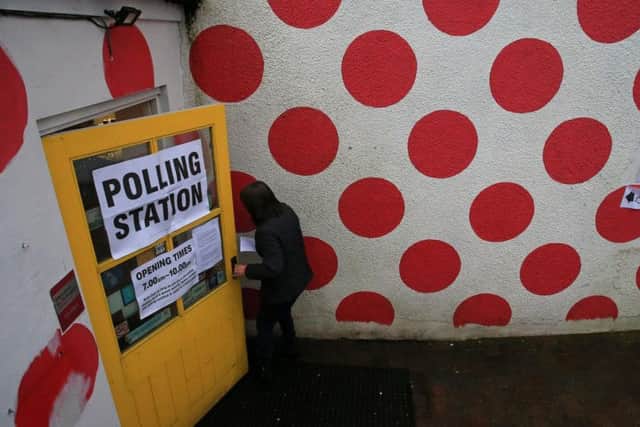 A voter heads to a polling station at Bank View Cafe, Sheffield, December 12 2019. Polling stations have opened across the UK for the December 2019 General Election. Photo: SWNS