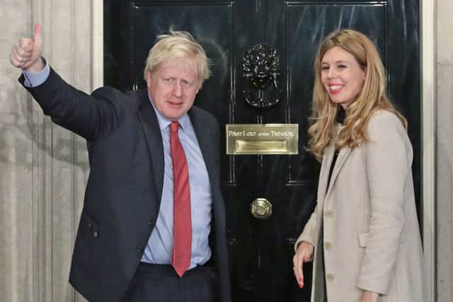Boris Johnson returns to 10 Downing Street with his girlfriend Carrie Symonds after his election win.