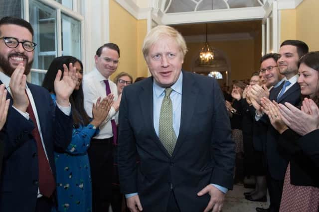 10 Downing Stret staff cheer Boris Johnson after his electiion win.