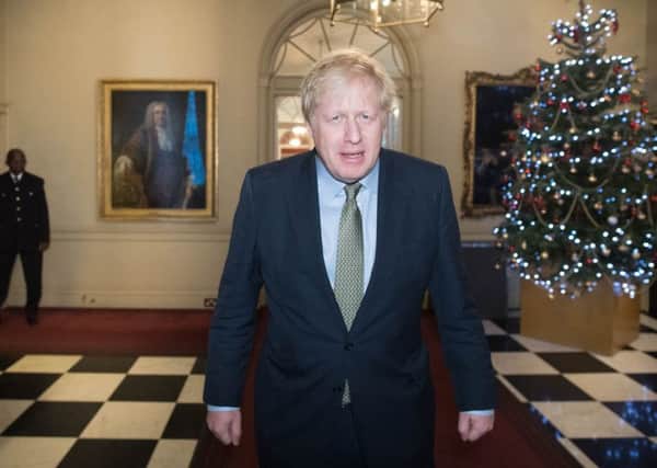 Boris Johnson returns to 10 Downing Street after being invited by the Queen to form a government.
