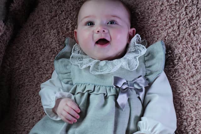 Baby Edie Long, now five months, is to spend her first Christmas at home after being born with a rare condition. Her family, so supported by The Sick Children's Trust, are backing an appeal to help other families who may wake on Christmas morning in hospital. Image: Simon Hulme