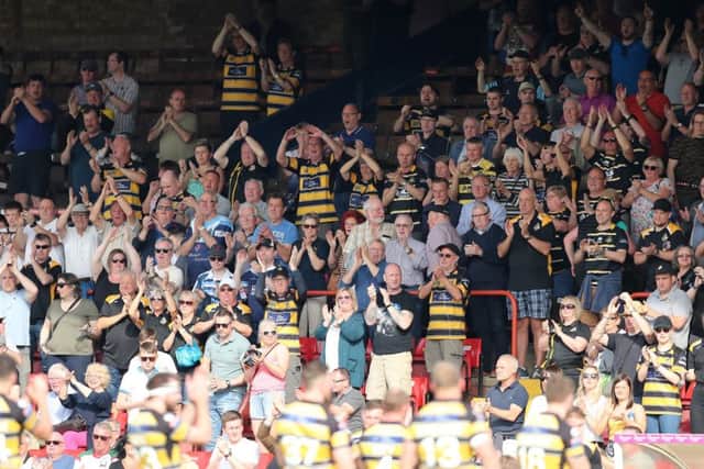 BACKING: Fans of York City Knights applaud their team during last season's clash at Bootham Crescent against Widnes. Picture by Ash Allen/SWpix.com