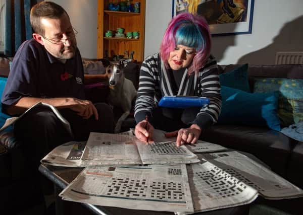 Cryptic crossword compiler John Henderson and his wife Jane. Picture by Bruce Rollinson.