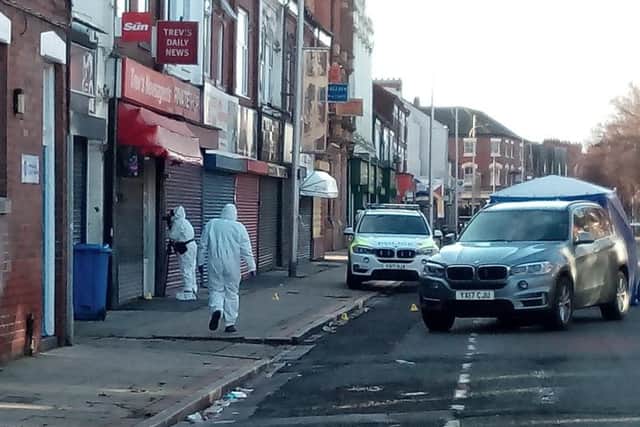 Forensics officers at the scene of the shooting on Hessle Road in Hull