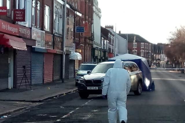 A forensics officer at the scene of the shooting on Hessle Road in Hull