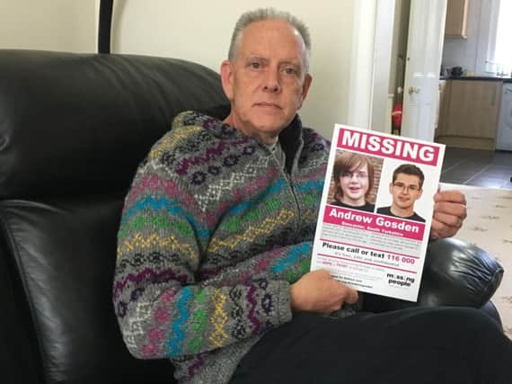 Kevin Gosden with a poster of his missing son Andrew.