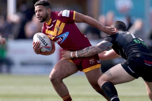 New Leeds signing from Huddersfield Giants, Kruise Leeming is tackled by London Broncos' Jay Pitts (Picture: PA)